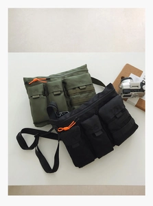 Close-up of utility outdoor crossbody bags in black and army green with functional pockets