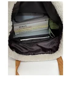 Detail view of the plush tote bag interior with zipper pocket and large capacity space