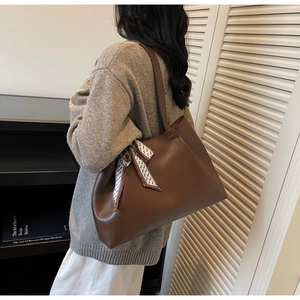 Brown large capacity tote bag with geometric silk ribbon detail on shoulder handle