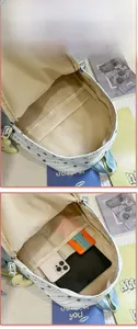 Internal view of nylon backpack showing spacious main compartment with multiple storage pockets