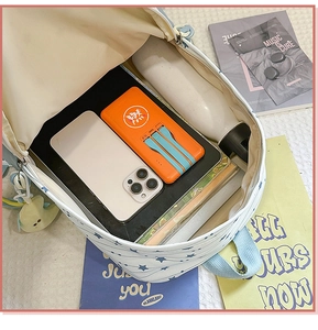 Detailed interior of a nylon school backpack showing large capacity for books and devices