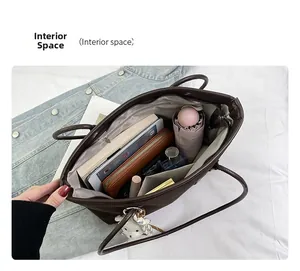 Interior view of large capacity dark brown tote bag showing organized storage space
