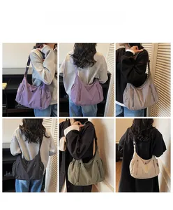 Vue détaillée de grands sacs à bandoulière en nylon de différentes couleurs par un mannequin