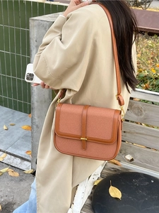 Brown woven crossbody square bag for women styled with autumn trench coat