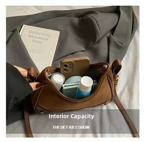 Internal capacity of the vintage brown suede hobo bag showing room for daily essentials