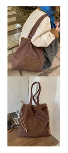 Detail of faux suede tote bag with plush apple patch and fleece trim in outdoor setting