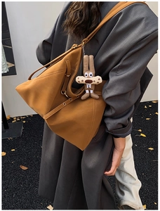 Shoulder tote bag in camel brown matte leather with cute plush rabbit pendant charm