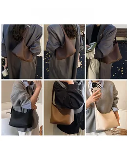 Fashionable hobo bag in soft pebbled leather finish worn as a shoulder bag