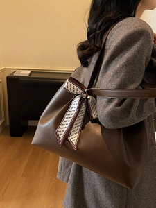 Brown large capacity leather tote bag with a decorative patterned silk scarf for women