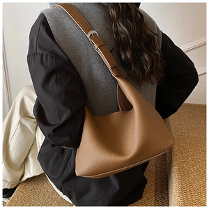 Detail of brown litchi pattern leather hobo bag with adjustable silver metal buckle