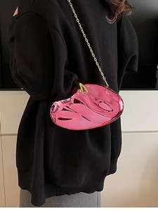 Rose pink acrylic evening clutch with unique curved design and gold chain strap