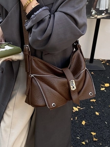 Vintage dark brown tote bag with pebble leather texture and metallic clasp detail