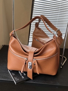 Caramel brown pebbled leather hobo shoulder bag with dual zippers and silver hardware
