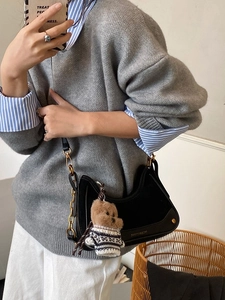 Retro black half-moon shoulder bag with gold chain and plush bear pendant detail