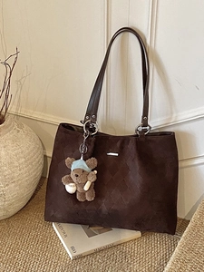 Brown woven tote bag with large capacity and a cute teddy bear charm for women