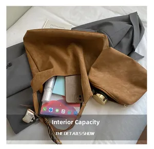 Macro detail of brown suede tote set showing large interior space for tablets and phones