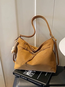 Minimalist camel brown hobo shoulder bag with adjustable strap and bear pendant
