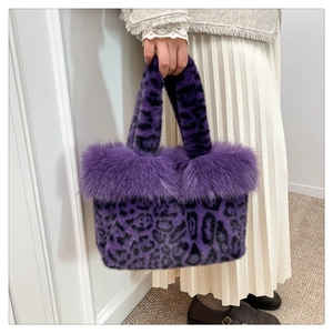 Detail of purple leopard faux fur tote bag with fluffy trim and dual handles