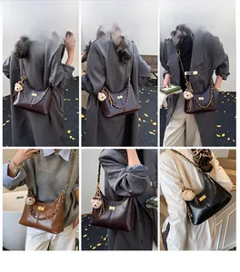 Chic leather crossbody bag with chain strap and cute bear charm in multiple colors