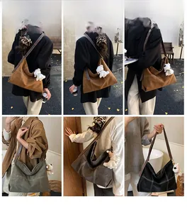 Détails du grand sac cabas avec coutures contrastées et charm de chien en peluche