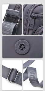 Details der lila Nylon-Umhängetasche mit Metallschnalle, Reißverschluss und Tragegurt