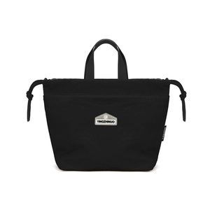Detail view of the durable nylon fabric texture and branding on this black tote bag