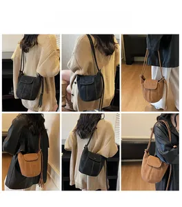 Détails d'un sac seau rétro avec franges décoratives et finitions de coutures contrastées