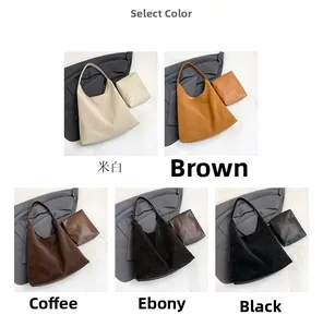 Detail view of large leather tote bag collection featuring inner pouch in five neutral colors