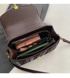 Interior view showing the large storage capacity of this vintage shoulder bag