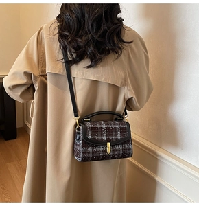 Classic plaid tweed shoulder bag shown on model with trench coat for elegant styling