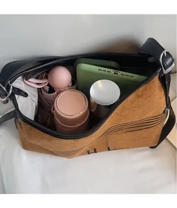 Spacious interior of brown velvet tote bag showing storage for tablet and umbrella