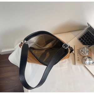 Top view of vintage brown suede tote bag showing interior lining and spacious pocket