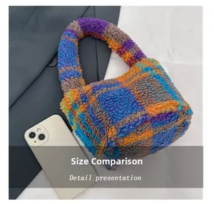 Detailed view of plaid plush handbag texture next to a smartphone for size comparison