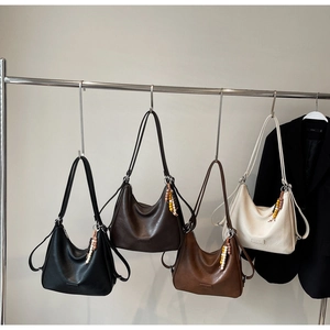 Four minimalist faux leather shoulder bags in black, coffee, brown, and off-white colors