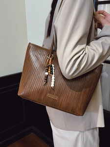 Brown woven texture tote bag for women shown as a stylish large shoulder bag