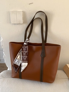 Brown vintage minimalist large tote bag with decorative bear silk scarf on shoulder strap