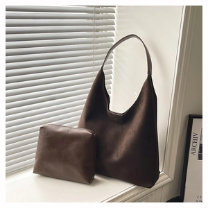 Detailed close-up of dark brown hobo tote set including a large bag and matching zip pouch