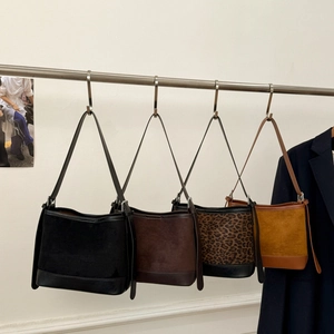 Suede and leather patchwork bucket bags in black, coffee, leopard print, and yellow