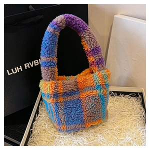 Close-up of colorful plush checkerboard tote bag in a gift box with soft texture detail