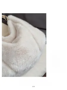 Close-up of soft white faux fur texture on a winter plush shoulder bag detail