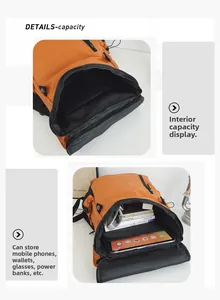 Détail de l'intérieur du sac à dos orange montrant le grand compartiment pour tablette et livres