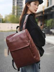Dark brown retro PU leather backpack with a flap top for urban commute or travel