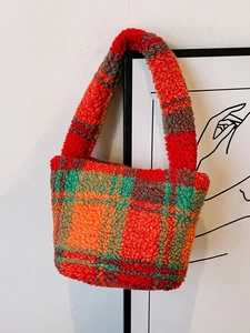 Colorful plush plaid tote bag with red, green and orange check pattern in soft fleece