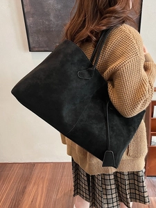 Large black faux suede tote bag with minimalist shoulder straps for women's daily commute