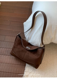 Close-up of the vintage brown frosted suede bag featuring a silver rectangular twist lock