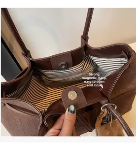 Close-up of woven tote bag showing strong magnetic buckle and striped lining