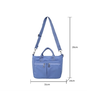 Blue nylon tote bag dimensions 31x20x14cm with dual handles and adjustable strap