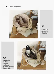Detail view of the large capacity interior compartments in this off-white canvas tote bag