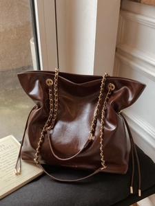 Vintage dark brown oil wax leather tote bag with stylish chain strap and drawstring detail