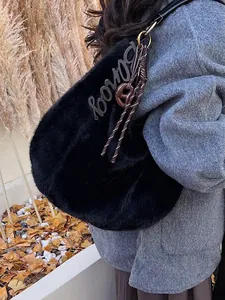 Chic black faux fur tote bag with woven rope strap for women's autumn winter fashion
